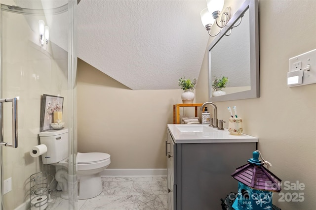 bathroom featuring a textured ceiling, vanity, toilet, and a shower with door