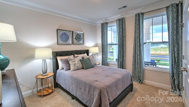 carpeted bedroom featuring ornamental molding