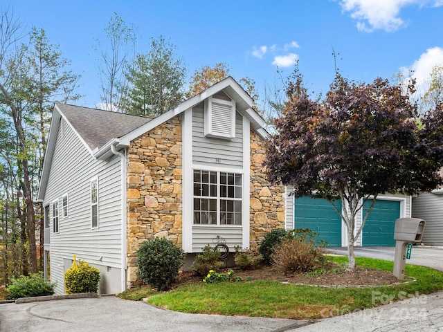 view of side of property featuring a garage