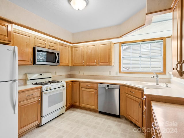 kitchen with appliances with stainless steel finishes and sink