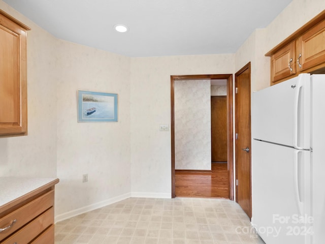 kitchen featuring light wood-type flooring and white refrigerator