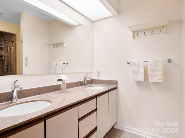 bathroom featuring vanity and tile patterned floors