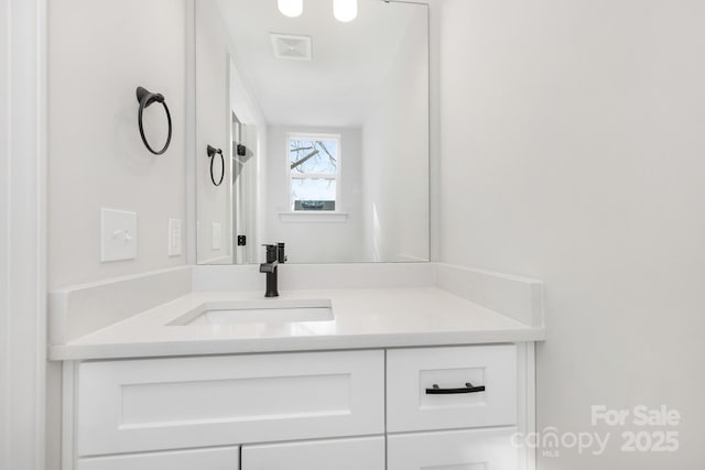 bathroom featuring vanity and visible vents