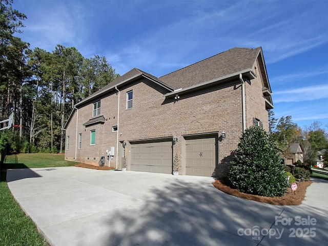 view of side of home with a garage