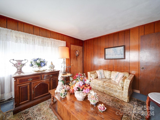 living room featuring wood walls