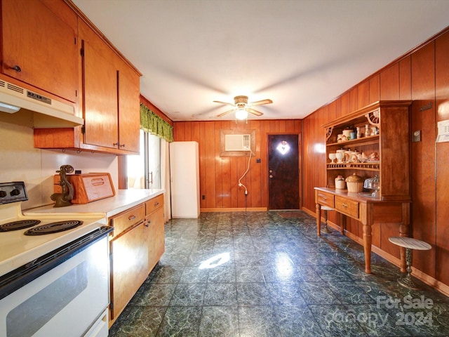 kitchen with white range with electric cooktop, wood walls, and ceiling fan