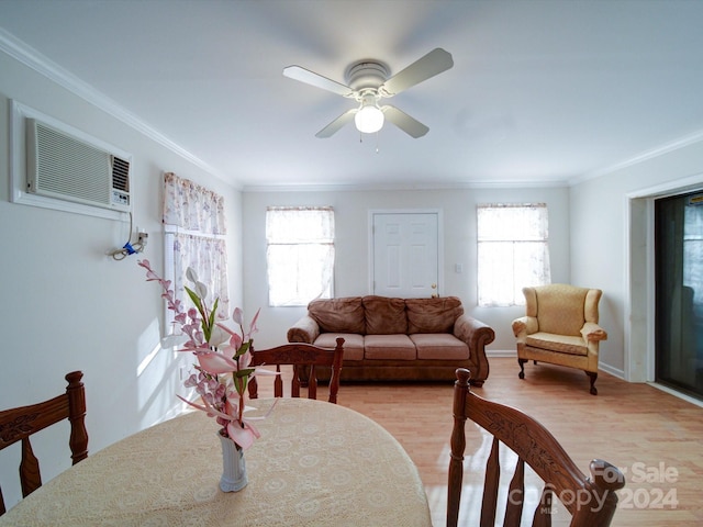 dining space featuring ceiling fan, crown molding, a healthy amount of sunlight, and light hardwood / wood-style floors