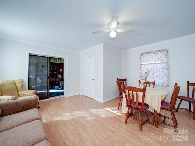 dining room with ceiling fan, light wood-type flooring, and crown molding