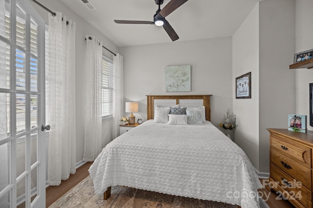 bedroom with wood-type flooring and ceiling fan