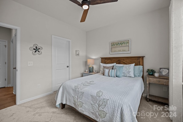 bedroom featuring ceiling fan and light hardwood / wood-style flooring