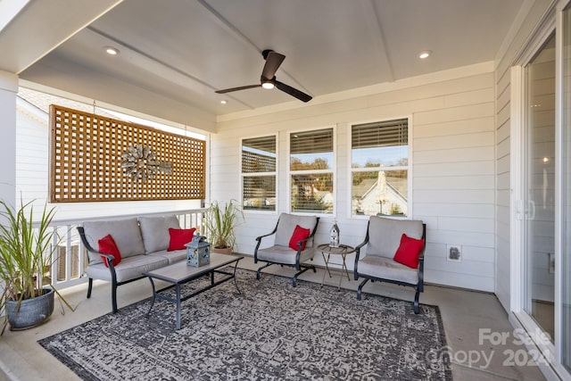 view of patio with ceiling fan and an outdoor living space