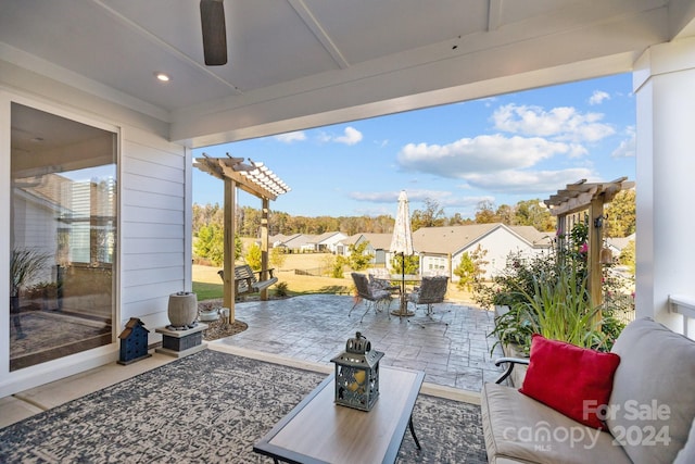 view of patio featuring ceiling fan and a pergola