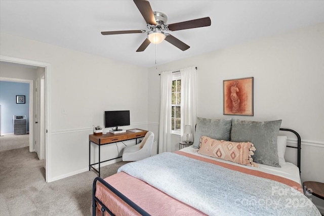 bedroom featuring ceiling fan and light carpet