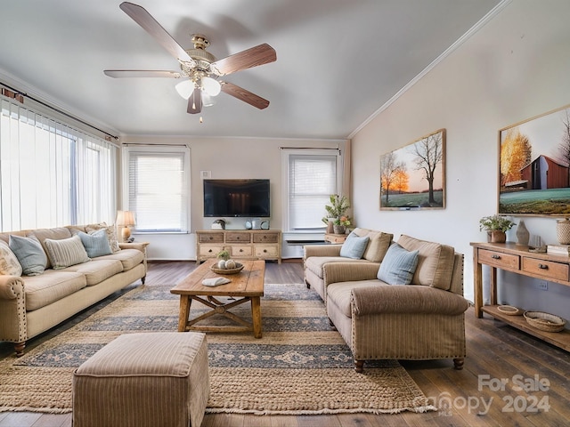 living room featuring dark wood-type flooring, a wealth of natural light, ceiling fan, and crown molding