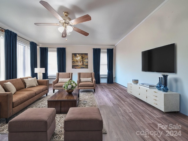 living room featuring ornamental molding, hardwood / wood-style flooring, and ceiling fan