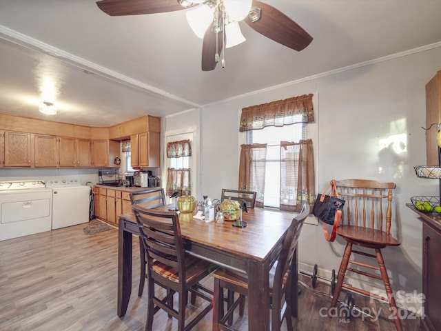 dining space featuring separate washer and dryer, crown molding, sink, light hardwood / wood-style floors, and ceiling fan