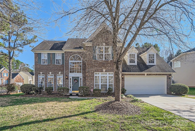 view of front of home with a garage and a front lawn