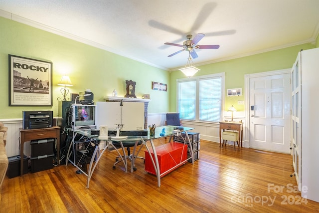 home office with hardwood / wood-style floors, ceiling fan, and crown molding