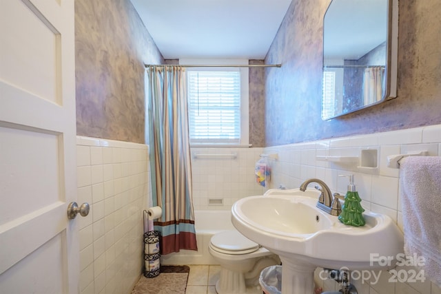 full bathroom featuring tile patterned flooring, shower / bath combination with curtain, tile walls, and toilet