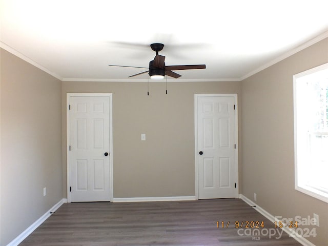 unfurnished bedroom with hardwood / wood-style flooring, ceiling fan, and crown molding