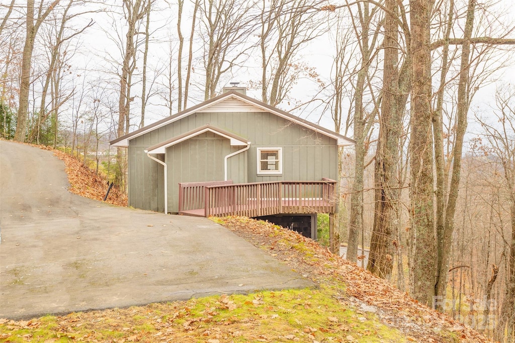 view of property exterior featuring a deck