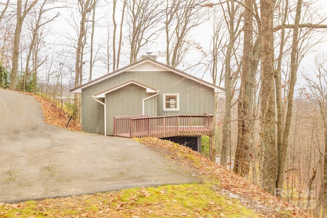 view of property exterior featuring a deck