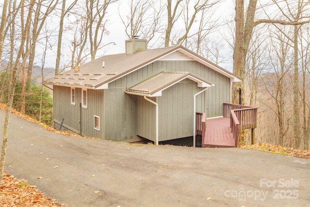 view of home's exterior featuring a wooden deck