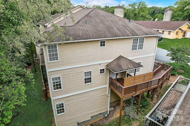 back of house with a balcony