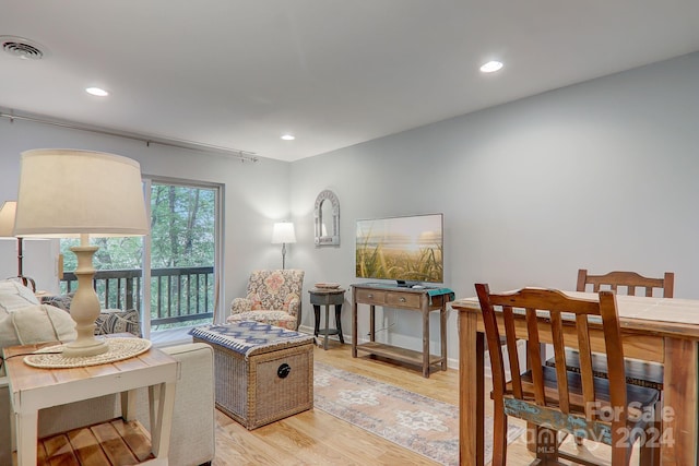 living area with light hardwood / wood-style floors