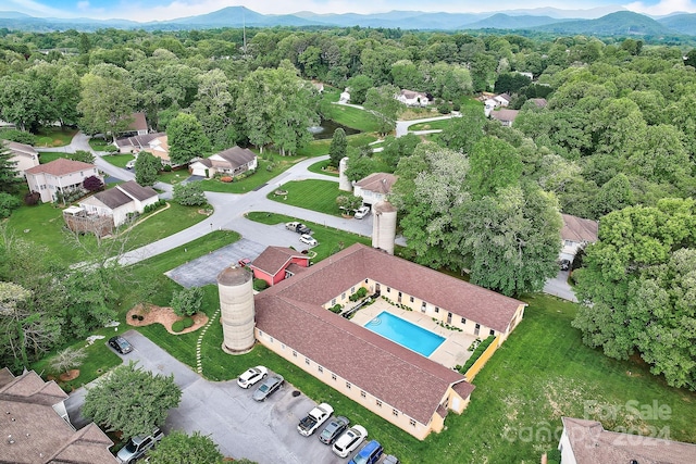 birds eye view of property with a mountain view