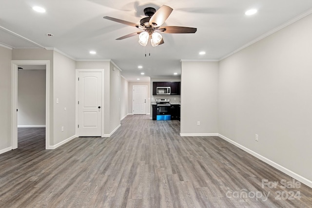 unfurnished living room featuring wood-type flooring, ceiling fan, and crown molding