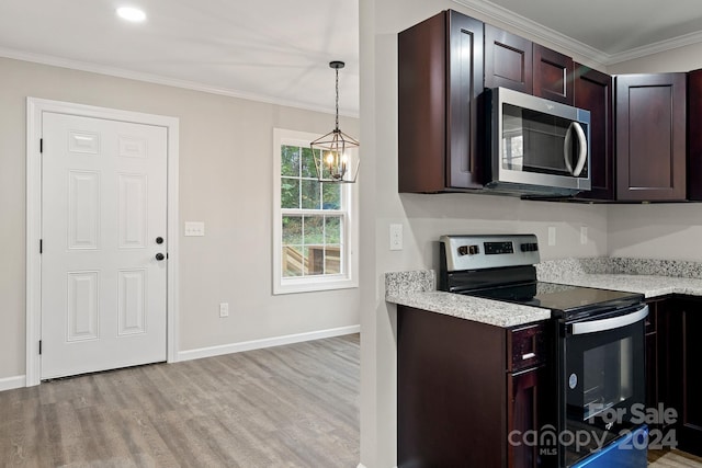 kitchen with stainless steel appliances, ornamental molding, hanging light fixtures, dark brown cabinets, and light hardwood / wood-style flooring