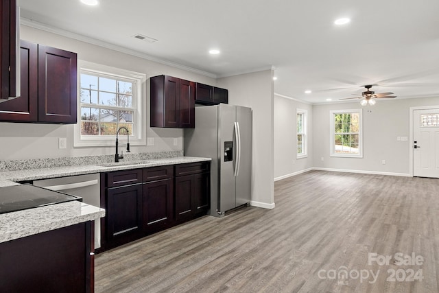 kitchen featuring stainless steel fridge with ice dispenser, sink, light wood-type flooring, and ornamental molding