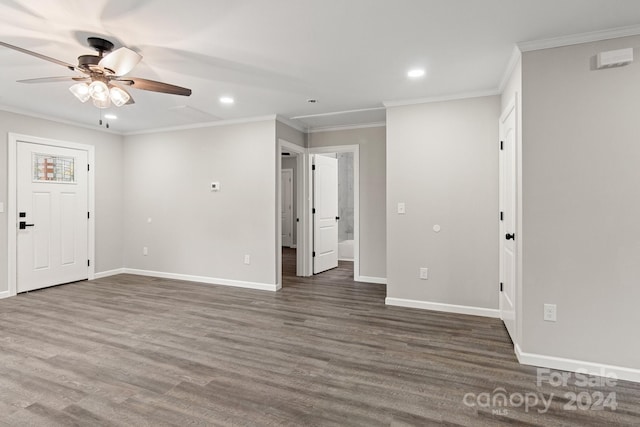 spare room with ceiling fan, dark hardwood / wood-style floors, and ornamental molding