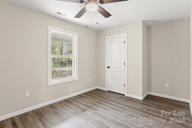 unfurnished room featuring hardwood / wood-style floors and ceiling fan