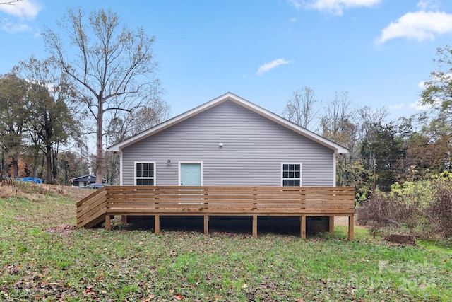 back of property with a wooden deck