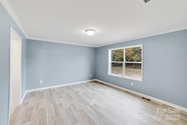 unfurnished room with light wood finished floors, visible vents, baseboards, and ornamental molding