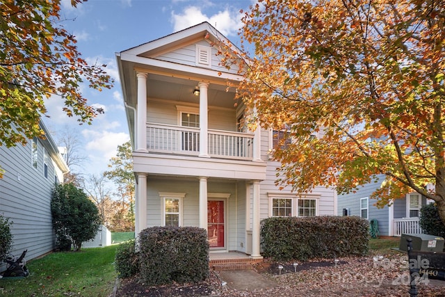 view of front of home featuring a balcony