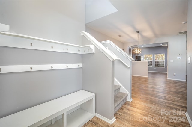 stairs with wood-type flooring