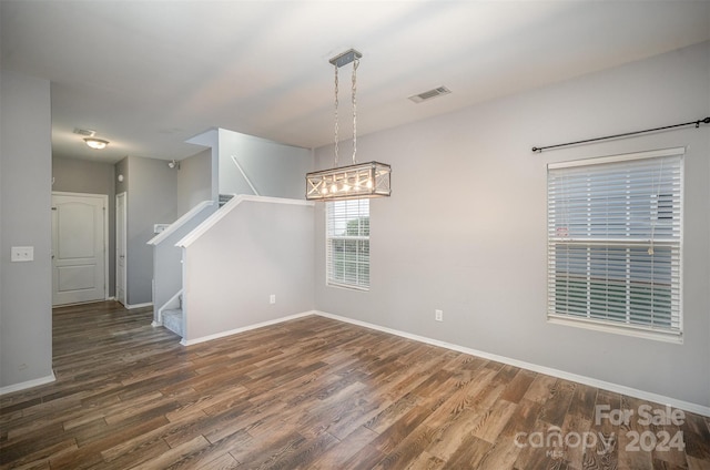 spare room with dark wood-type flooring