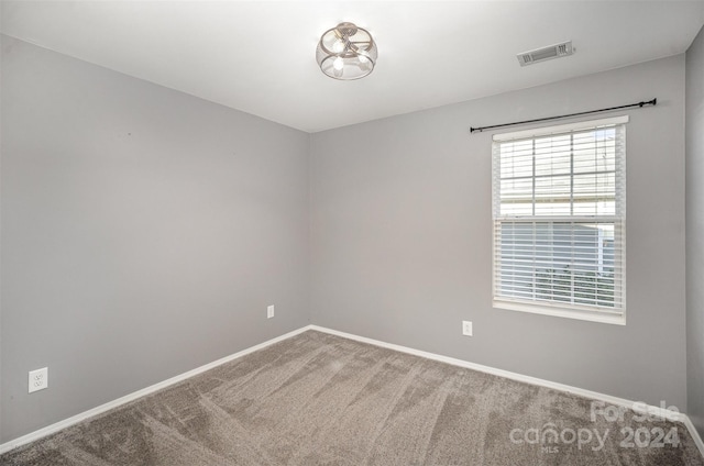 unfurnished room with carpet floors