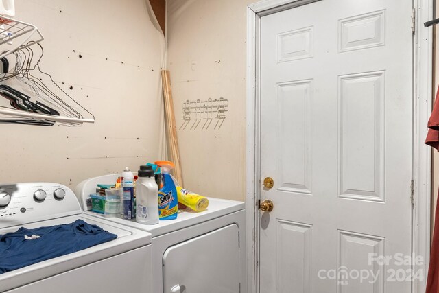 laundry room with separate washer and dryer