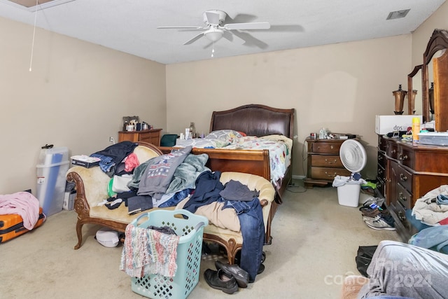 bedroom featuring ceiling fan and light carpet