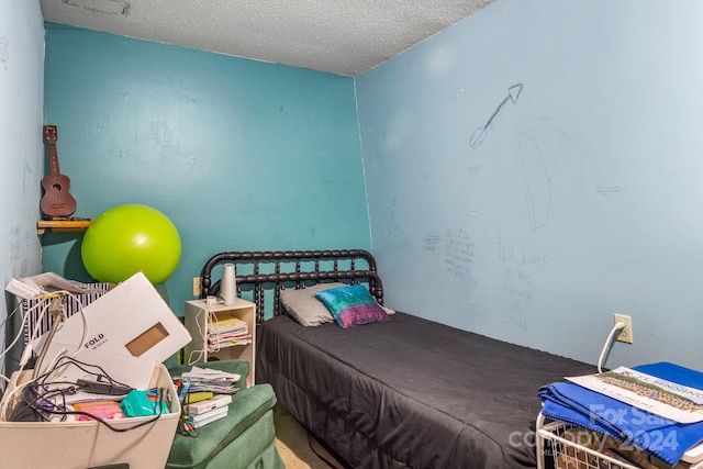 bedroom featuring a textured ceiling