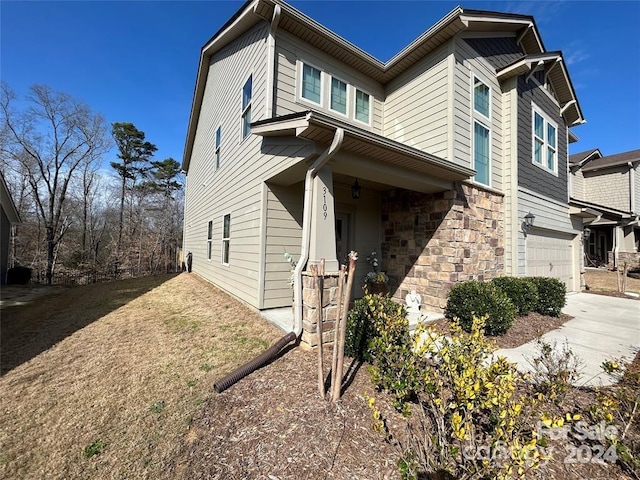 view of side of home with a garage