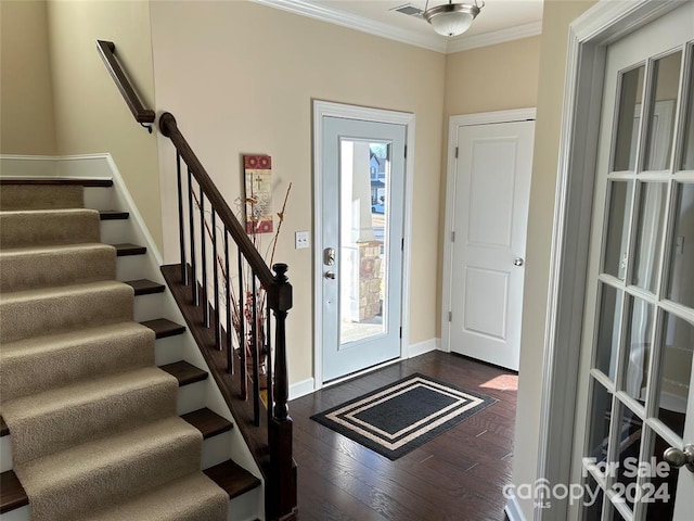 entryway with crown molding and dark wood-type flooring