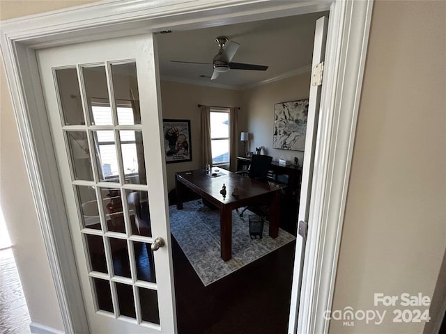 office area featuring ceiling fan and ornamental molding