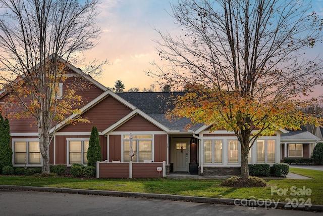 view of front of house with a lawn