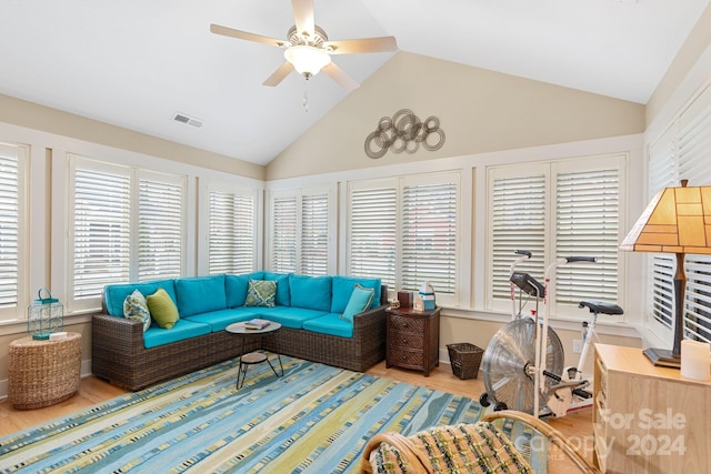 living room featuring a wealth of natural light, ceiling fan, light hardwood / wood-style flooring, and high vaulted ceiling