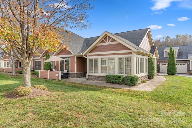 rear view of house featuring a lawn